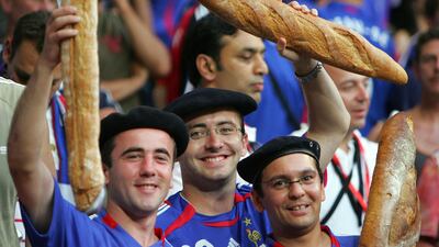 French supporters holding baguettes prior to the World Cup 2006 semi-final football match. AFP