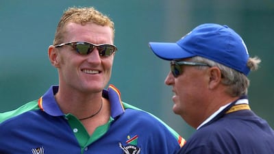 Current UAE coach Dougie Brown, left, was seconded to the Namibia cricket team's coaching staff for the 2003 Cricket World Cup on the advice of Warwickshire coach Bob Woolmer, right. PA
