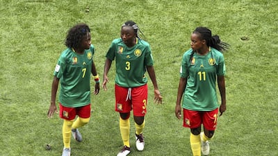 Gabrielle Aboudi Onguene of Cameroon consoles Ajara Nchout during the 2019 FIFA Women's World Cup France Round Of 16 match between England and Cameroon at Stade du Hainaut in Valenciennes, France. Getty Images