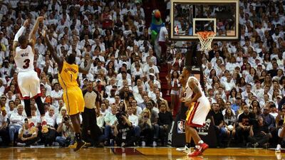 Dwyane Wade of the Miami Heat shoots a three-pointer against the Indiana Pacers during Miami's Game 3 win over Indiana on Saturday night. Mike Ehrmann / Getty Images / AFP / May 24, 2014
