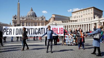 People protest against war in Syria, keeping one metre distance at the St. Peter's Square where Pope Francis will deliver the weekly Angelus prayer via video. Reuters