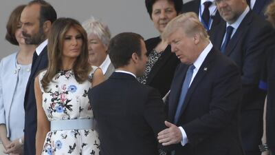 French president Emmanuel Macron greets the Trumps.Saul Loeb / AFP Photo