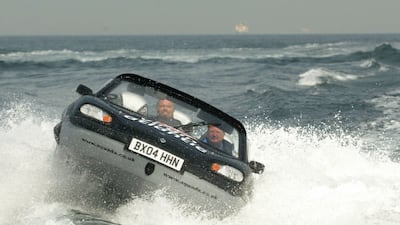 Sir Richard Branson pilots his Gibbs Aquada amphibious car during a record-breaking 2004 crossing of the English Channel.