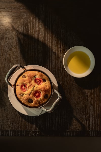 House-made focaccia bread and oil are complimentary at Arva. Photo: Aman