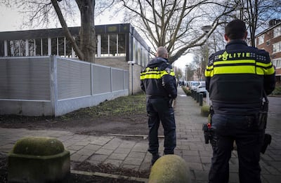 Dutch police officers stand guard near a Jewish school in Amsterdam. AFP