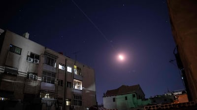 Flares of Syrian air defence rockets are seen in the sky of Damascus. AFP