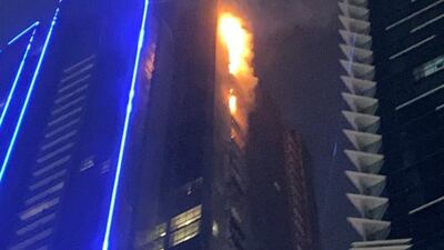 Flames rise up Duja Tower near Trade Centre roundabout on Thursday night. The blaze has left residents temporarily without homes. Supplied image