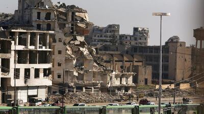 Buses waiting to evacuate civilians and rebels from eastern Aleppo are seen parked in the government-controlled area of Ramouseh on December 15, 2016. Omar Sanadiki/Reuters