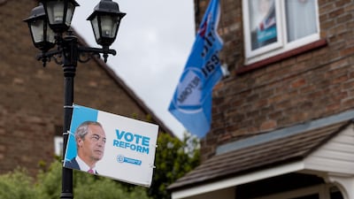 A Reform Party election sign hangs from a lamppost in Ashton-in-Makerfield, England. Getty Images