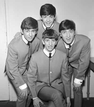 The Beatles pose for an early group portrait in 1963. Clockwise from left: George Harrison, Paul McCartney, John Lennon and Ringo Starr. Getty Images