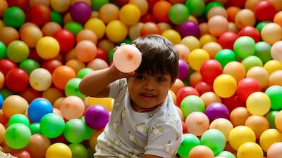 A child with autism plays in a ball pit at the Parimala Neurodiagnostic and Rehabilitation Centre, in Bangalore, India, on the eve of World Autism Awareness Day. EPA