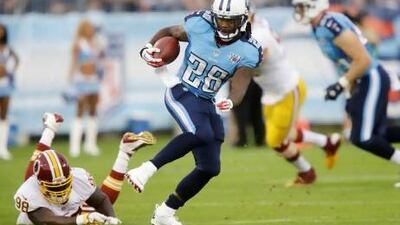 Tennessee Titans running back Chris Johnson (28) gets past Washington Redskins linebacker Brian Orakpo (98) while running 58 yards for a touchdown in the first quarter of a preseason NFL football game on Thursday, Aug. 8, 2013, in Nashville, Tenn. (AP Photo/Wade Payne) *** Local Caption *** Redskins Titans Football.JPEG-00752.jpg