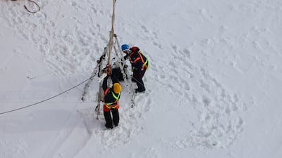 Clare Eayrs and Daiane Faller install a mast on sea ice in the Southern Ocean in 2019. The mast supports instruments to measure turbulent and radiative fluxes.