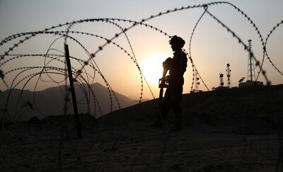 Afghan soldiers stand guard at a checkpoint on the outskirts of the city of Jalalabad on October 19 2017. Security in Nangarhar province was intensified following a Taliban attack on a military base in Kandahar province that killed around 50 soldiers earlier in the day. Ghulamullah Habibi / EPA