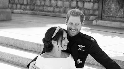 This photo released by Kensington Palace on Monday May 21, 2018, shows an official wedding photo of Britain's Prince Harry and Meghan Markle, on the East Terrace of Windsor Castle AP