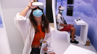 Visitors watching the VR show at the Palestine pavilion. Pawan Singh/The National