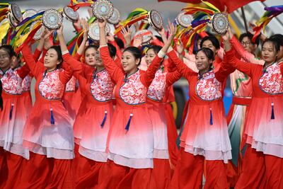 Performers dance as Argentina's President Alberto Fernandez arrives at Beijing's airport on Tuesday for the Belt and Road Forum in China. Getty Images