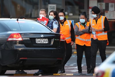 Employees of the Countdown mall in New Lynn, Auckland, wait to leave with police after a stabbing attack on September 3, 2021. Getty Images