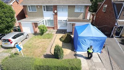 A police officer stands outside a house in Chester after a healthcare professional working at the Countess of Chester Hospital was arrested on suspicion of murdering eight babies on July 4, 2018 in Chester, United Kingdom. Christopher Furlong / Getty