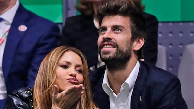 Colombian singer Shakira blows a kiss next to her husband Barcelona soccer player Gerard Pique in happier days for their relationship. AP