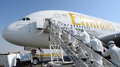 Cleaning staff boarding an Emirates Airbus A380-800. AFP