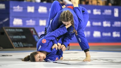 Samantha Cook from the UK, and Kendall Reusing from USA compete at the Abu Dhabi Grand Slam championship in jiu-jitsu