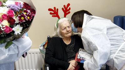 Mary Orme embraces her mother Rose McKimm, during a Christmas Day visit at Aspen Hill Village care home in Hunslet, Leeds. The care home was able to host almost 50 visits for family members during the Christmas period. Getty Images