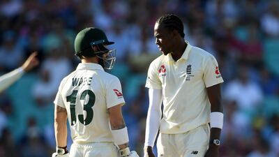 Jofra Archer, right, and Matthew Wade during Sunday's play at The Oval. Getty