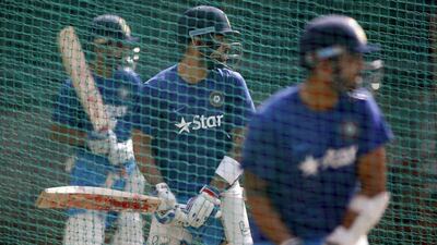 India cricket team captain Virat Kohli, centre, bats in the nets with teammates Murali Vijay, right, and Ajinkya Rahane during a training camp at the National Cricket Academy in Bangalore, India, Saturday, July 2, 2016. Aijaz Rahi / AP Photo
