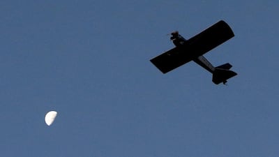 Night owl. Mr Hadrava pilots Vampira home as the moon rises. David W Cerny / Reuters