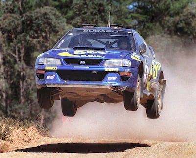 Colin McRae competing in the World Rally Championship in his Subaru Impreza. AFP