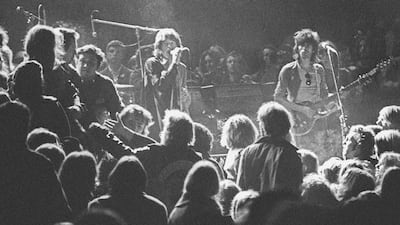 Mick Jagger and Keith Richards of the Rolling Stones warily eye the Hells Angels onstage at The Altamont Speedway on December 6, 1969, in Livermore, California. Courtesy Robert Altman/Michael Ochs Archives/Getty Images