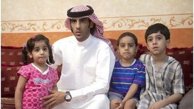Ahmed al Dhamani with his daughter Fajer, son Magad and nephew Fahad in the family home.