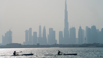 Kayakers race in front of the Burj Khalifa, the world's tallest building, off the coast of Dubai. AP Photo