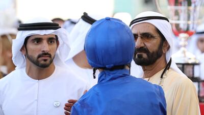Sheikh Mohammed bin Rashid and Sheikh Hamdan bin Mohammed, Crown Prince of Dubai, speaking to Godolphin jockey William Buick after his victory on Blue Point in the Al Quoz Sprint. Chris Whiteoak / The National