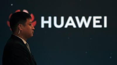 In this Jan. 9, 2019, photo, a security guard stands near the Huawei company logo during a new product launching event in Beijing. The Chinese Foreign Ministry said late Friday, January 11, it is "closely following the detention of Huawei employee Wang Weijing" on charges of allegedly spying for China. AP
