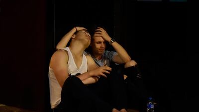 People react as police attend to an incident near London Bridge in London. Hannah McKay / Reuters