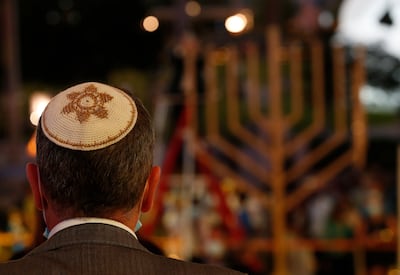 A Jewish man attends the celebration of the festival of Hanukkah at Expo 2020 Dubai. EPA