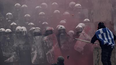 Protesters clash with police near Greek Parliament during a demonstration against an agreement between Greece and The Republic of Macedonia to allow Skopje to rename its country as the Republic of North Macedonia. AFP