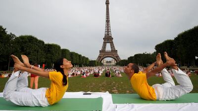 People gather for an open-air yoga session near the Eiffel Tower in Paris, France. Philippe Wojazer / Reuters