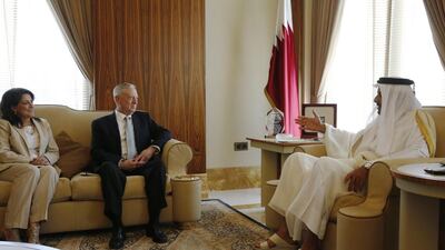 Qatar's Emir Sheikh Tamim Bin Hamad Al Thani, right, talks with US defence secretary James Mattis, centre, and US ambassador to Qatar Dana Shell Smith at his residence, the Sea Palace, in Doha on April 22, 2017. Jonathan Ernst / Pool Photo via AP