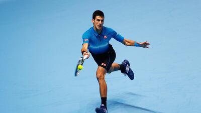 Novak Djokovic of Serbia plays a forehand against Kei Nishikori of Japan during Day 1 of the ATP World Tour Finals at O2 Arena in London. Getty Images