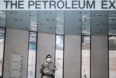 n Austrian Armed Forces soldier wearing a face mask patrols in front of the Organization of Petroleum Exporting Countries (OPEC) headquarters in Vienna, Austria, on April 9, 2020. EPA