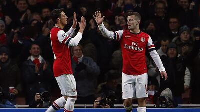 Jack Wilshere, right, scored twice for Arsenal on Tuesday night. Eddie Keogh / Reuters