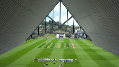 New Zealand, left, and the West Indies line up on day one of the second international Test cricket match at the Basin Reserve, in Wellington. AFP