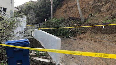 Debris from a mudslide blocks a street in the Laurel Canyon. an upscale neighbourhood in Los Angeles. AP