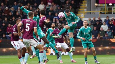 Liverpool's Andy Robertson heads at goal. Reuters