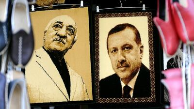 Embroidered images of United States-based Turkish cleric Fethullah Gulen and Turkey's prime minister Recep Tayyip Erdogan are displayed in a shop in the Gaziantep market on January 17 in Gaziantep, near the Turkish-Syrian border. Ozan Kose/AFP Photo