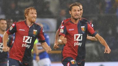 Genoa's Luca Antonini, right, celebrates after scoring against Sampdoria during their Italian Serie A soccer match at Luigi Ferraris stadium in Genoa on Sunday. Luca Zennaro / EPA