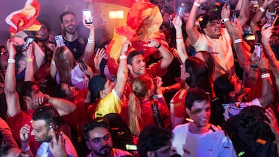 Delighted Spain fans at the Bla Bla football fan zone in Dubai watch their team win the World Cup. Photos: Ruel Pableo for The National